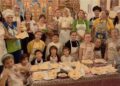 Moșii de toamnă: Copiii românilor din Italia învață la biserică să prepare colivă și colaci