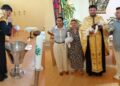 Botez plin de emoție în Austria: Părintele Vasile Melinte și preoteasa Ana Maria l-au creștinat pe micuțul Cristian-Iosif